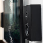 Black Argon Audio Forus 4 In-Wall and Outdoor Speakers installed on a wall, showcasing sleek design and outdoor audio performance.
