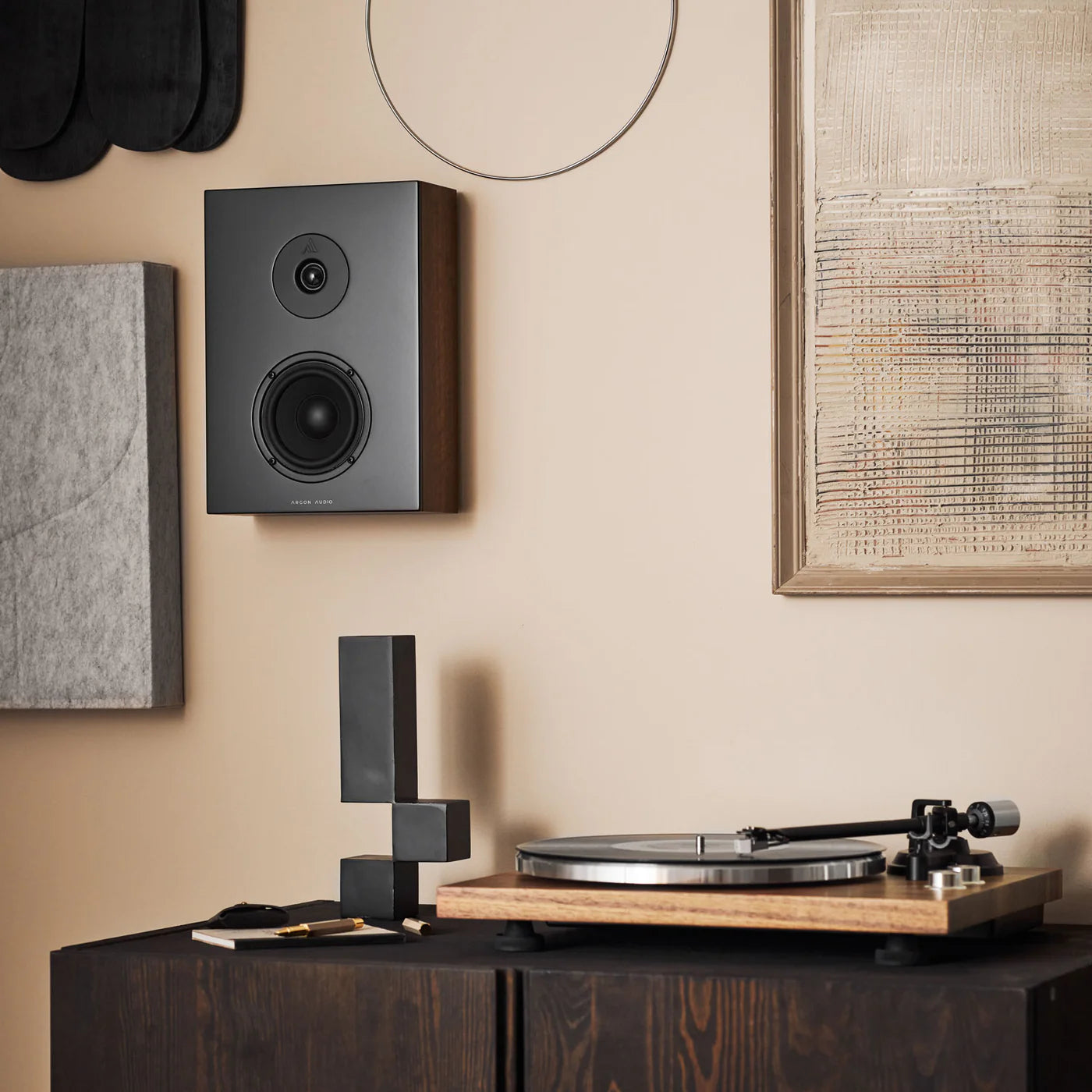 Argon Audio Forus 4 Wall in-wall and outdoor speakers installed on a wall, showcasing sleek design and outdoor use capability.