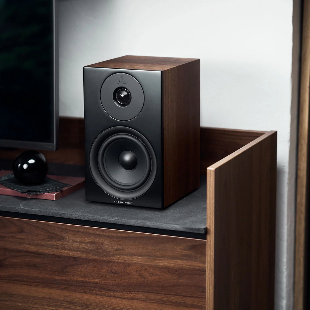 Argon Audio Forus 5 passive bookshelf speakers with black wood finish and front-facing drivers, designed for home audio use.