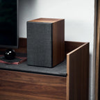 Argon Audio Forus 5 passive bookshelf speakers with black wood finish, showcasing sleek design and detailed speaker grilles.