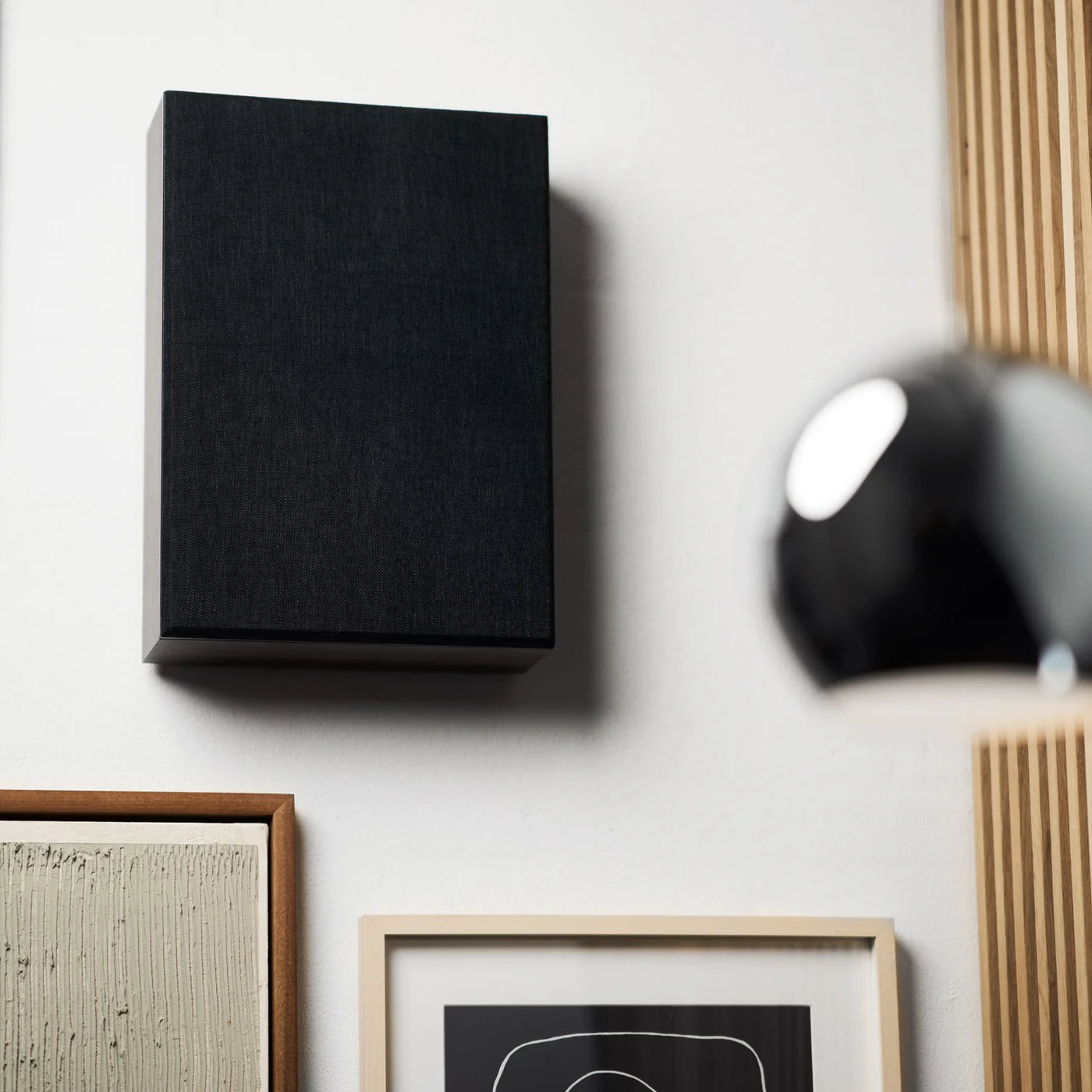 Argon Audio Forus 5 wall-mounted in-wall and outdoor speaker with sleek black design, suitable for outdoor or indoor audio.