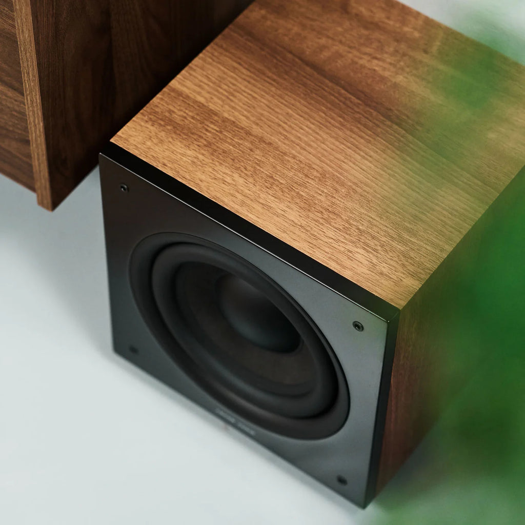 Argon Audio Malmö Sub 8 subwoofer with black finish, compact design, and speaker grille, designed for deep bass sound.