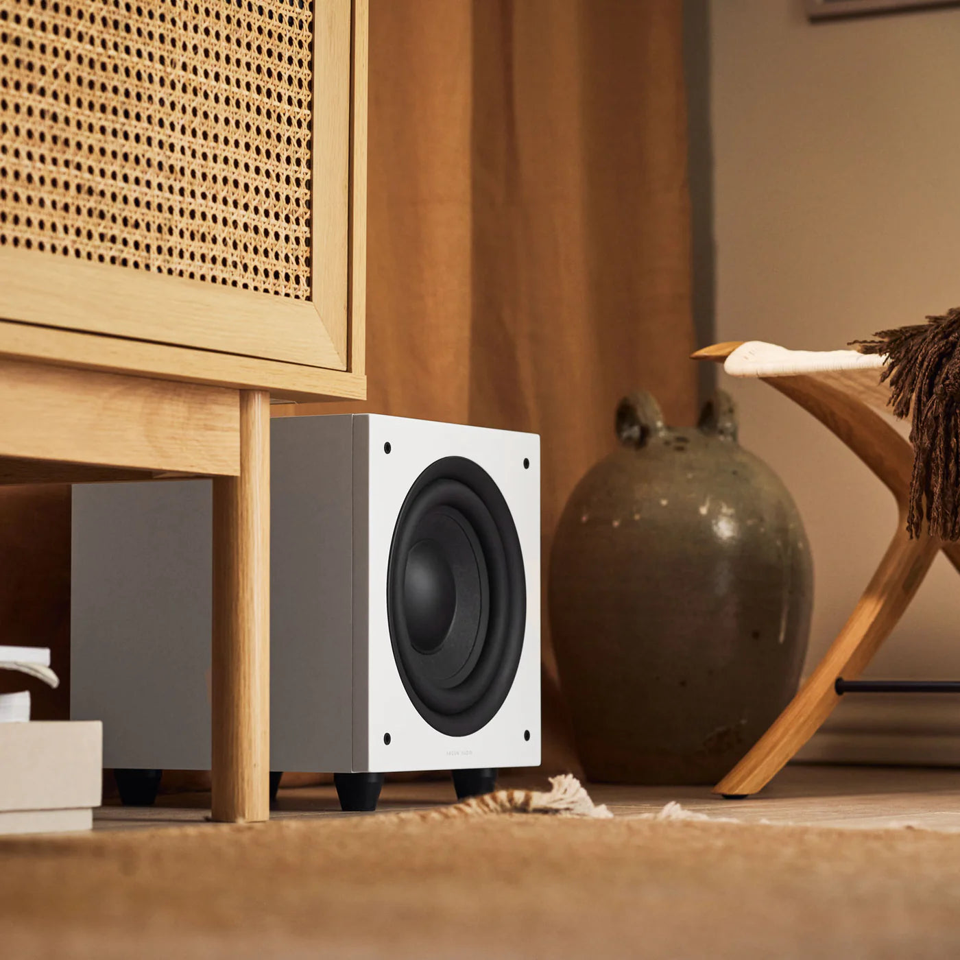 Argon Audio Malmö Sub 8 subwoofer with white finish, compact design, and front-facing speaker grille, ideal for home audio systems.