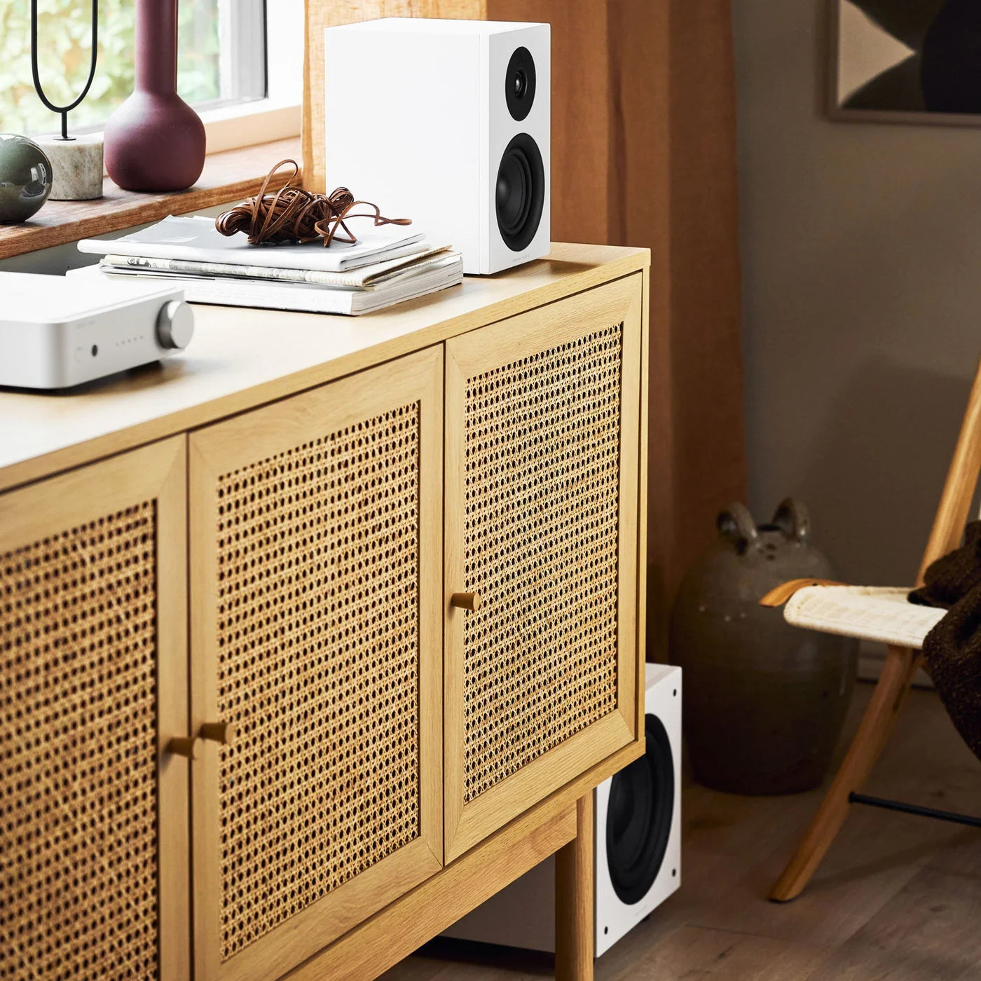 Argon Audio Forus 4 passive bookshelf speakers with white finish, shown from the front with speaker grille and wood cabinet accents.