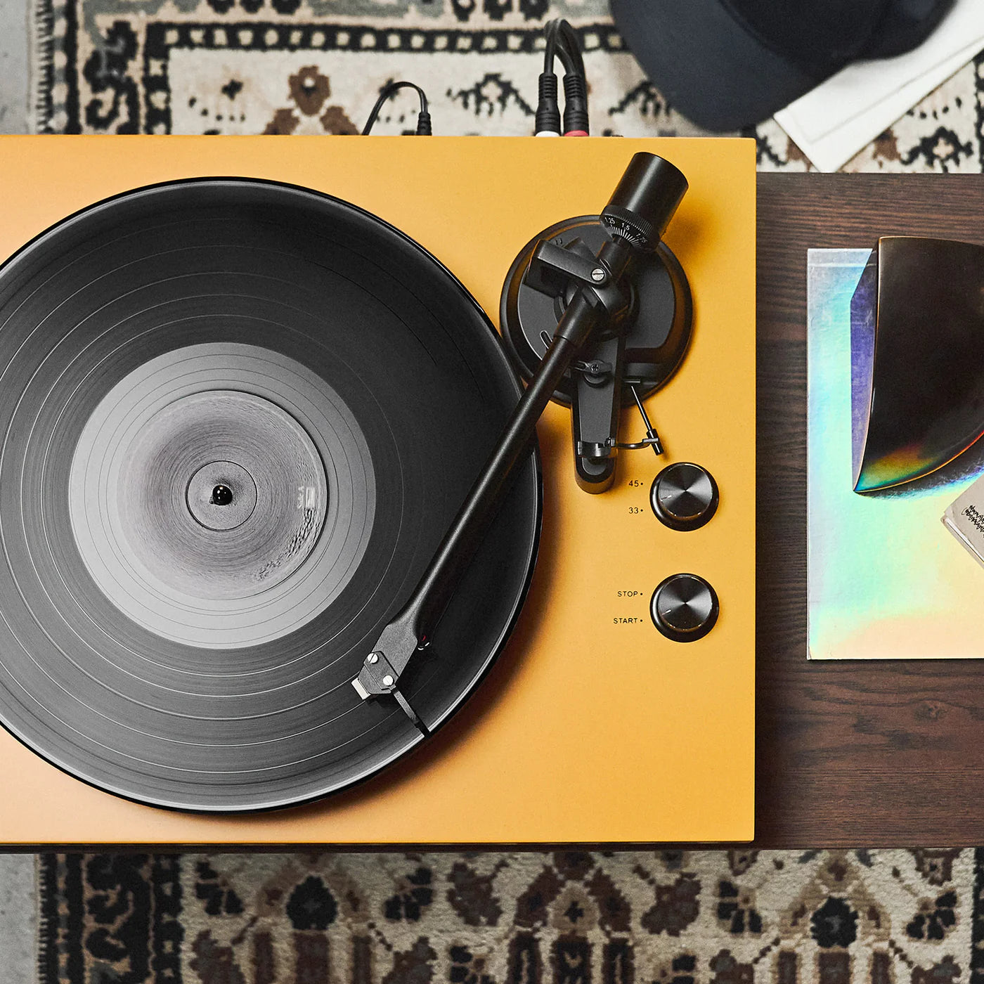 Argon Audio TT MK2 turntable with a sleek black finish and aluminum tonearm, showcasing its modern design and control features.