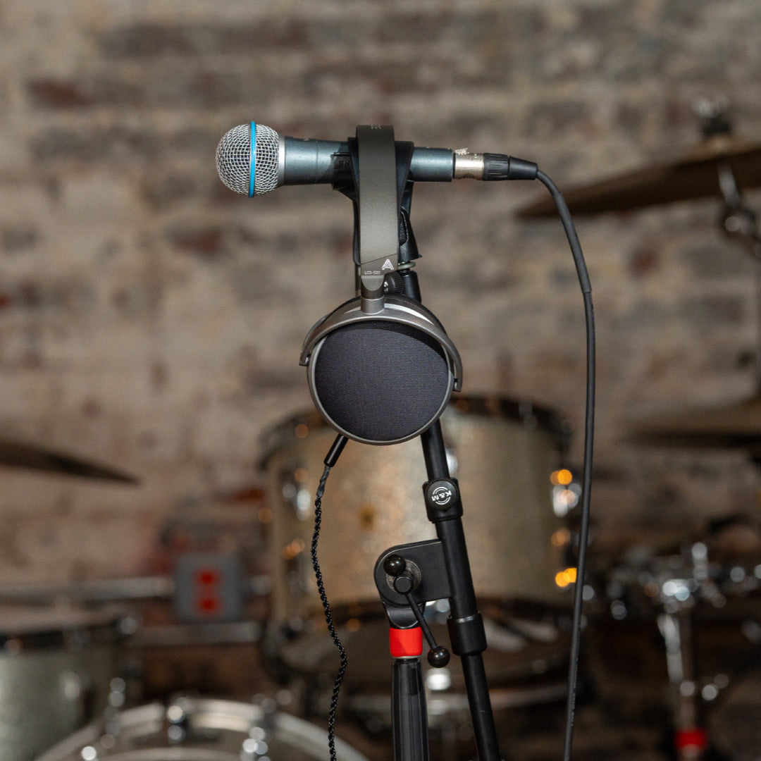 Audeze LCD-S20 studio headphones with large over-ear design and open-back ear cups, featuring sleek black finish and adjustable headband.