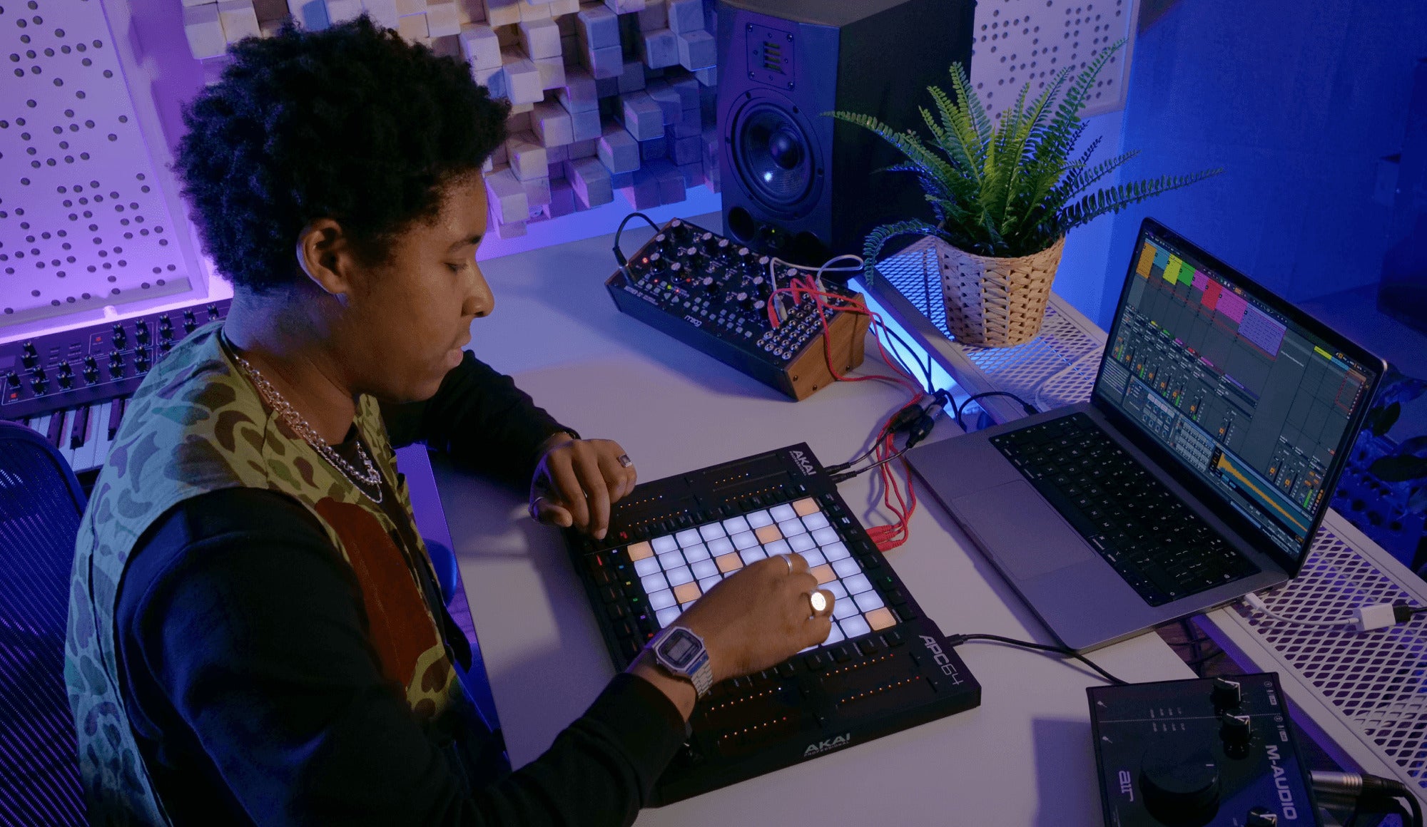 Akai Professional APC64 MIDI controller with 64 pads, knobs, and buttons for music production and live performance.