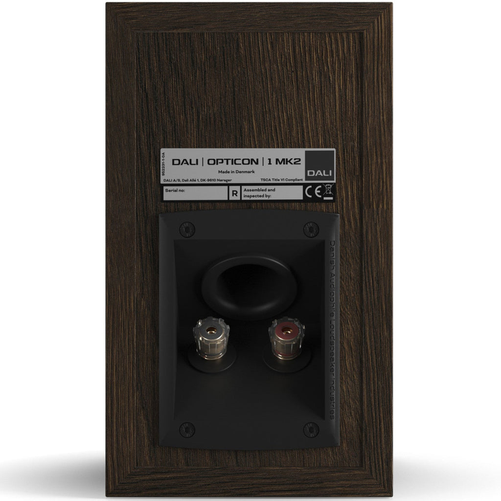 DALI Opticon 1 MK2 passive bookshelf speakers shown from the front with black speaker grilles and wood finish accents.