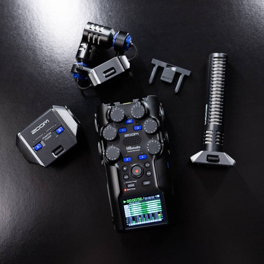 Zoom H6 studio digital recorder with three capsules and adjustable inputs, shown with detailed controls and recording ports.