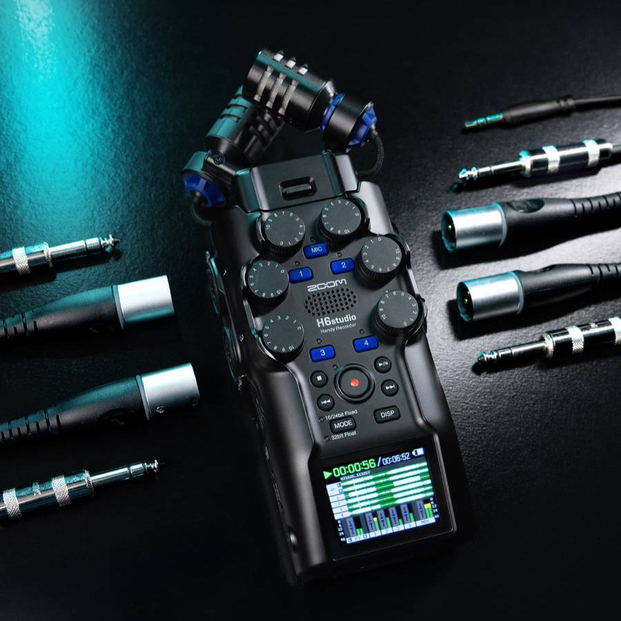 Zoom H6studio digital recorder with multiple input ports and controls visible in the image.