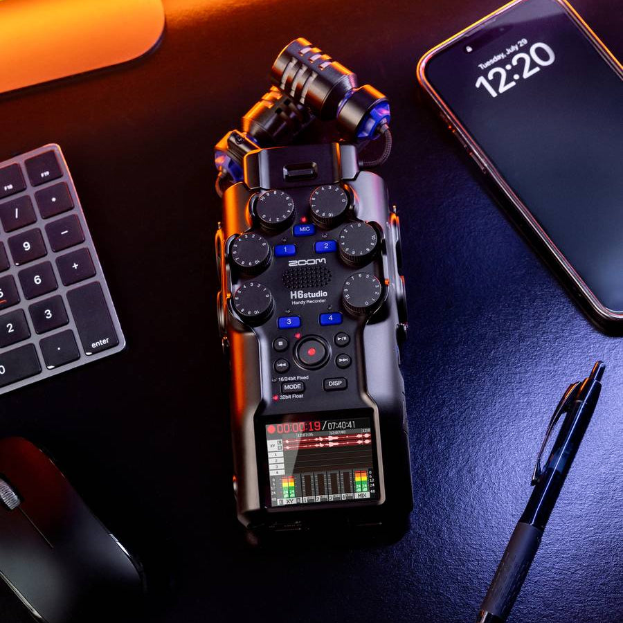 Zoom H6 Digital Recorder with RF shielding, shown with protective shield covering the device for noise reduction and improved audio quality.