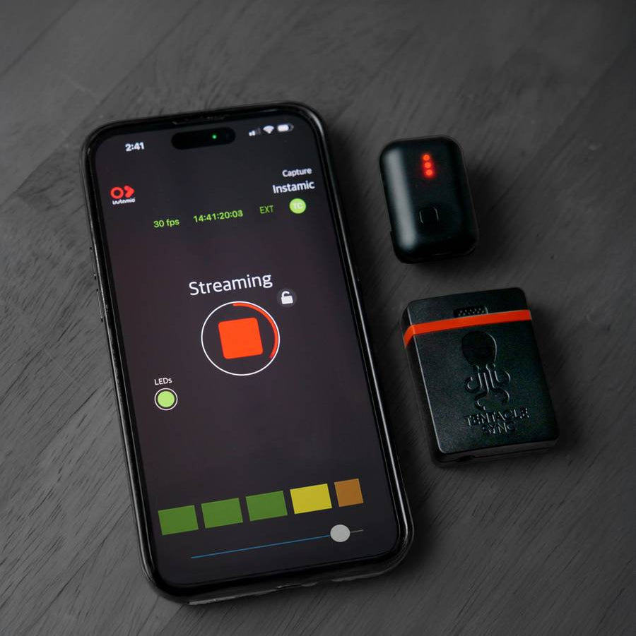 Instamic Pro Plus C portable recorder with tentacle sync cable, compact device for high-quality audio recording.