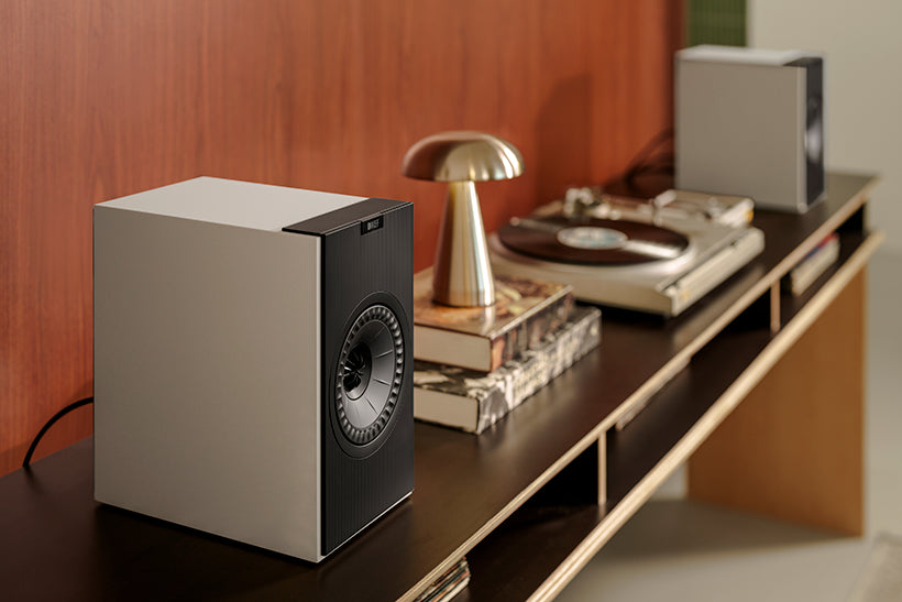 KEF Coda W active bookshelf speakers, grey, lifestyle.