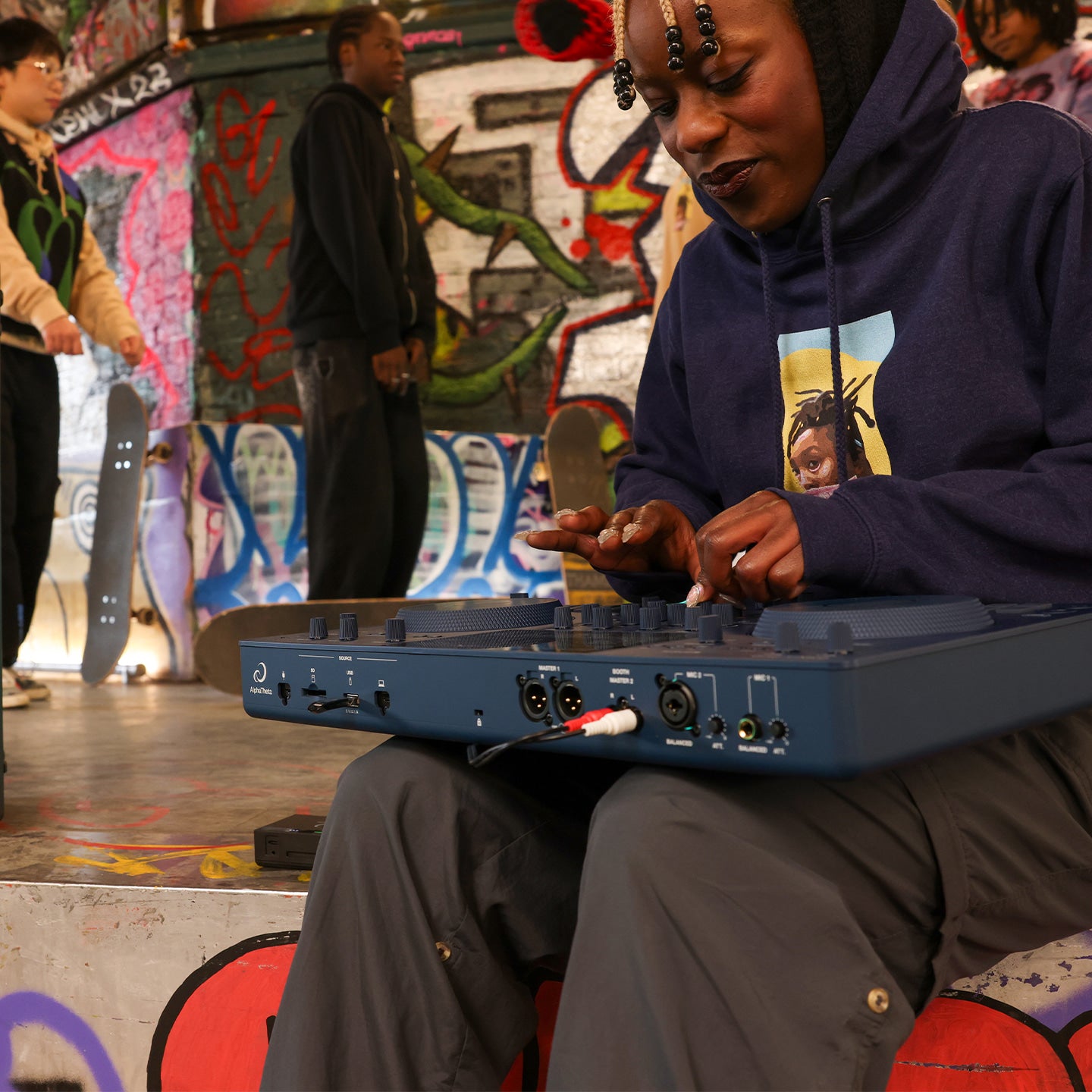 AlphaTheta Omnis-Duo DJ media player with dual decks, colorful controls, and professional audio interface.