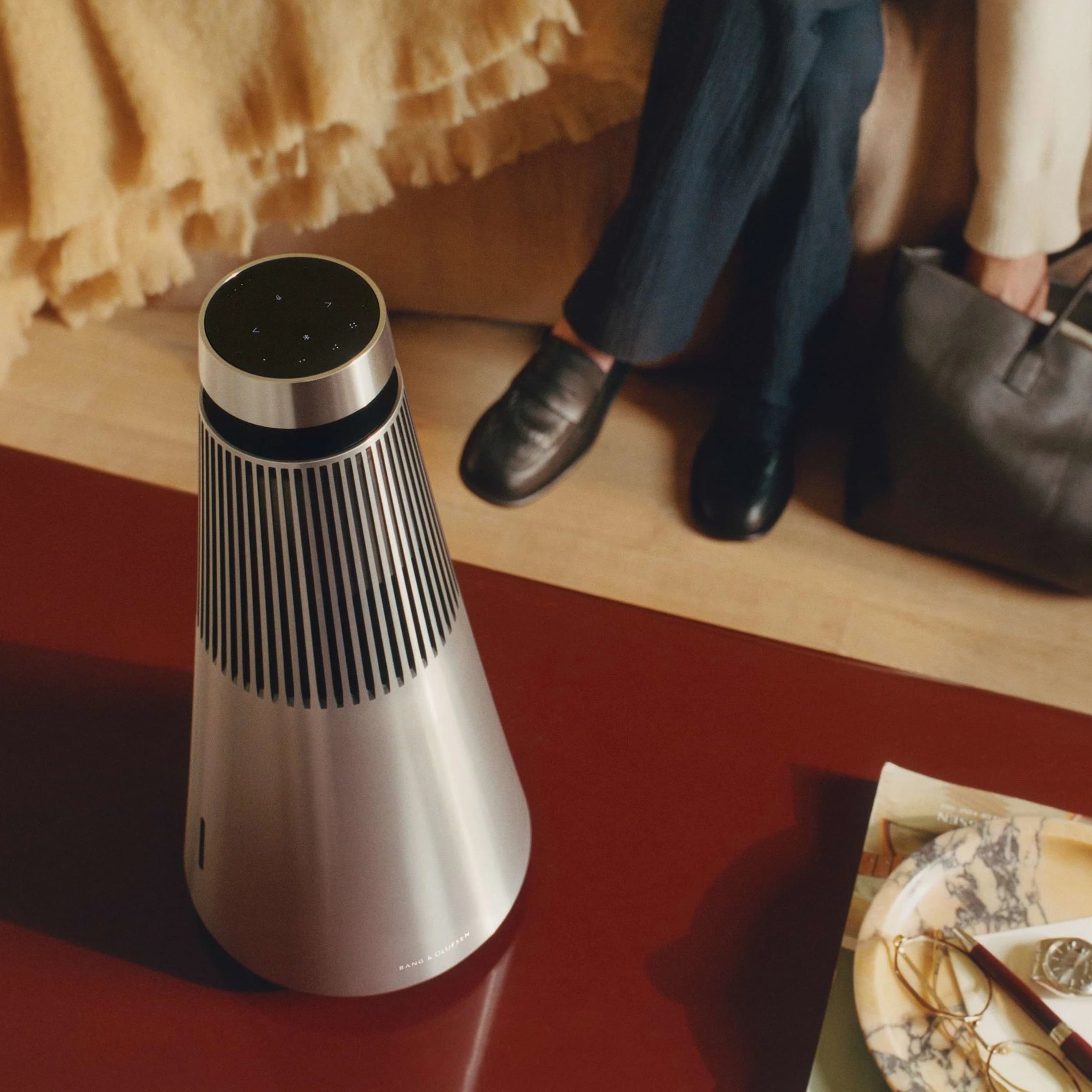 Bang & Olufsen Beosound 2 3rd Gen wireless speaker in a stylish home setting with sleek design and premium finish.