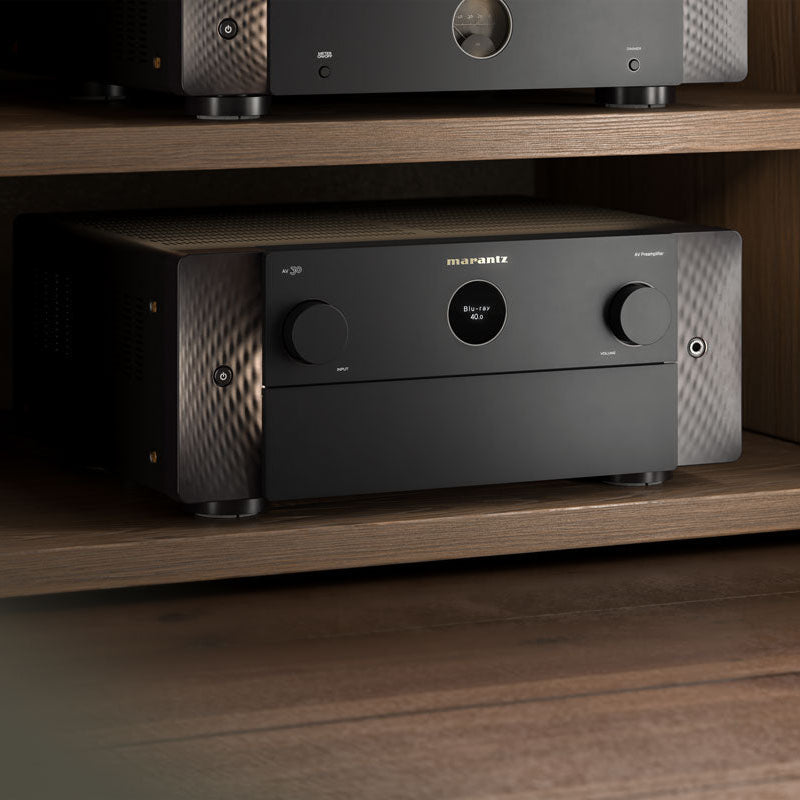 Marantz AV 30 stereo amplifier with sleek black design and control knobs visible on the front panel.