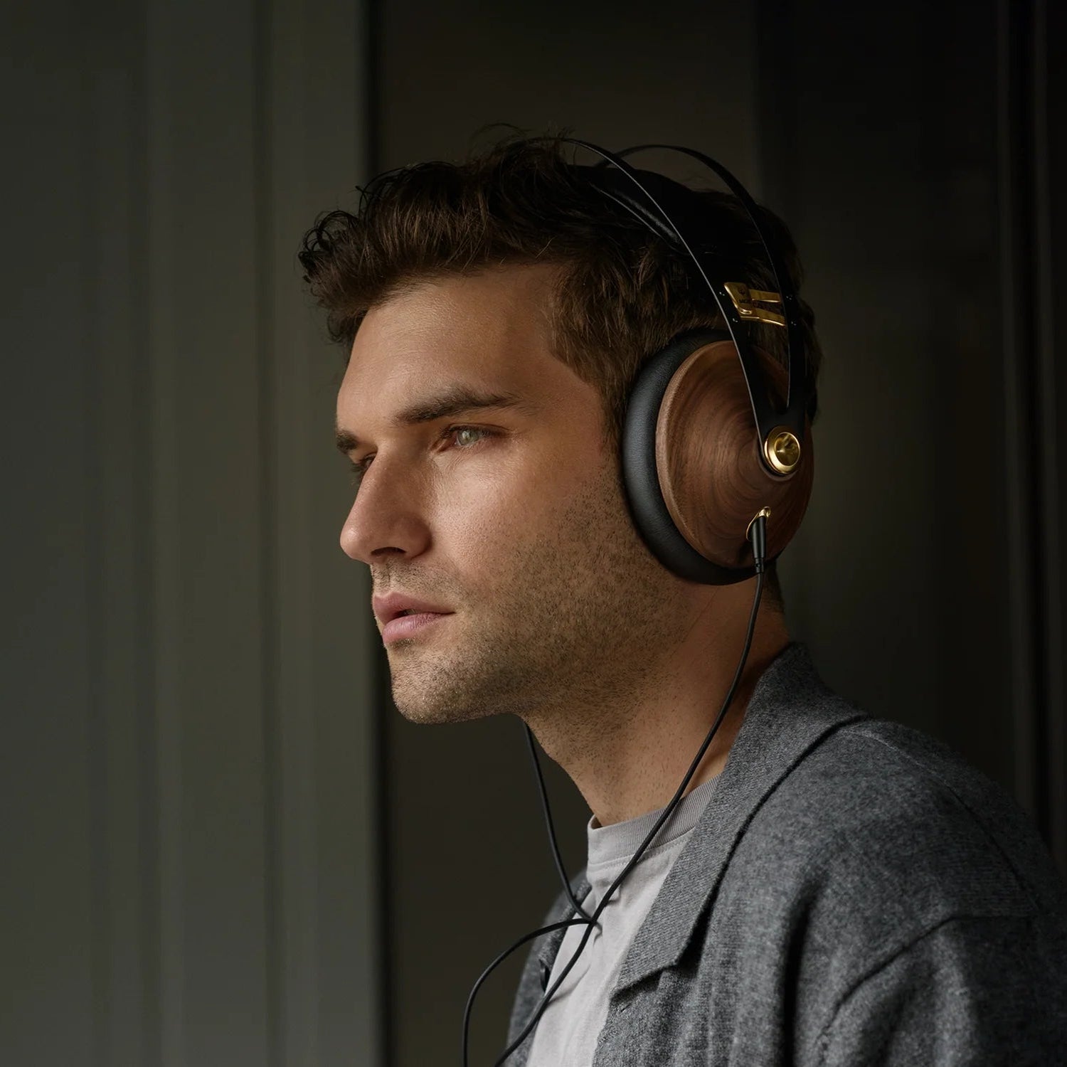 Meze Audio 99 Classics 2nd Gen wired headphones with wood ear cups and black headband, close-up view of the headphones.