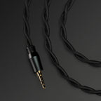 Meze Audio 99 Classics 2nd Gen wired headphones with wooden ear cups and metal accents, showing the input socket.
