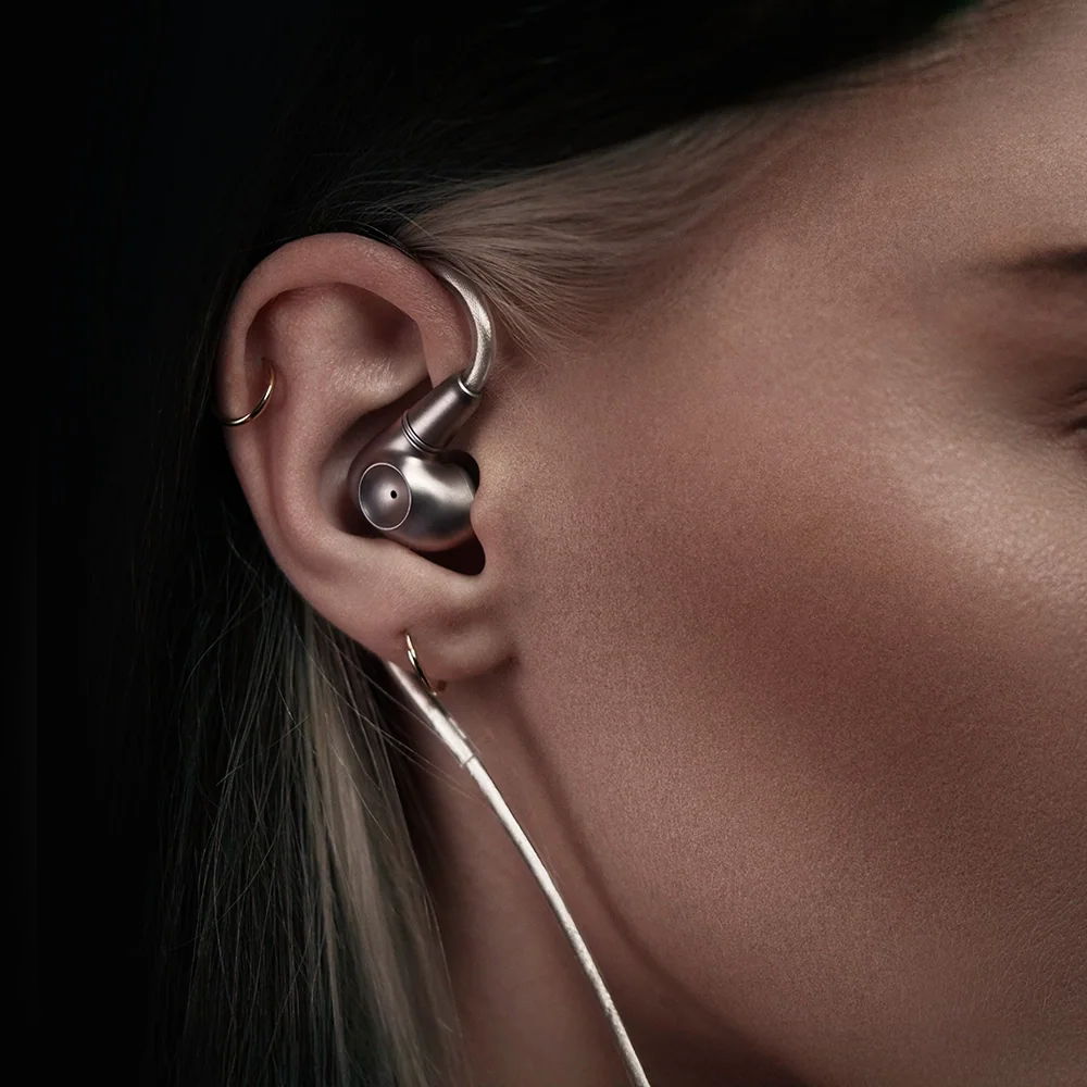 Meze Audio Astru wired in-ear monitor headphones with sleek black design and in-ear listening buds.