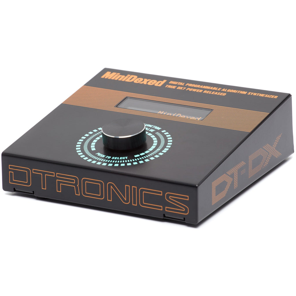 Dtronics DT-DX synthesizer with compact design, featuring control knobs and keyboard, displayed in front of a dark background.