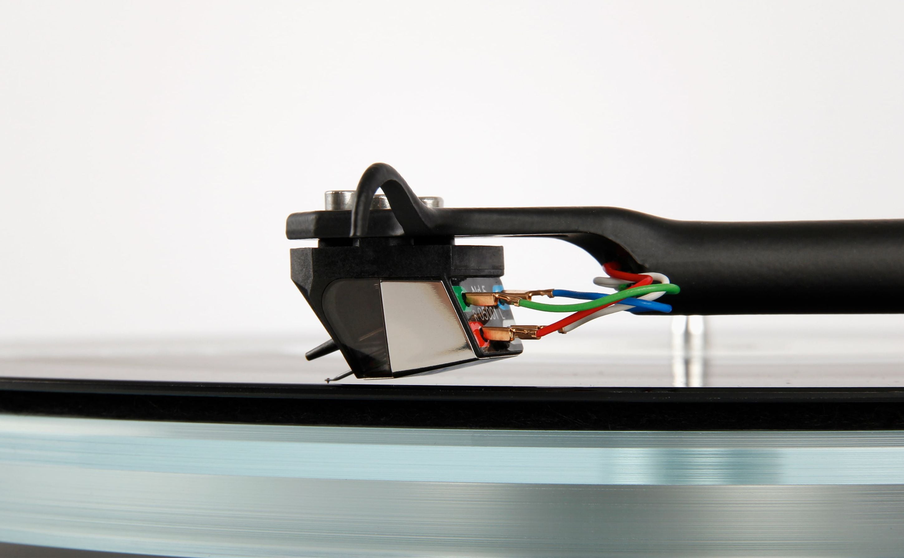 Rega ND5 turntable cartridge with detailed stylus and housing, designed for high-quality audio playback on turntables.