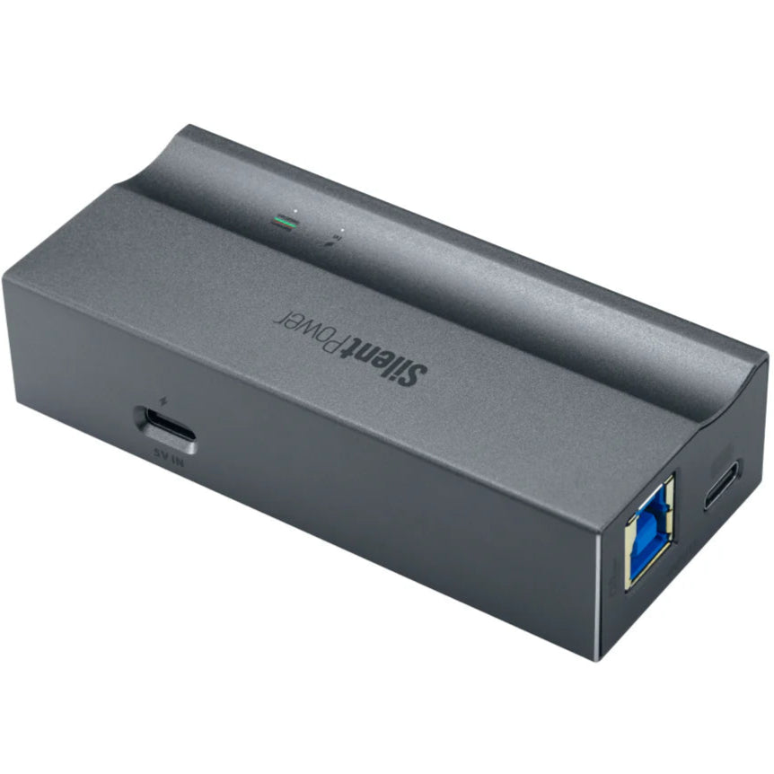 SilentPower USB iPurifier Pro noise filter and conditioner plugged into a computer USB port, reducing electrical noise for cleaner power.