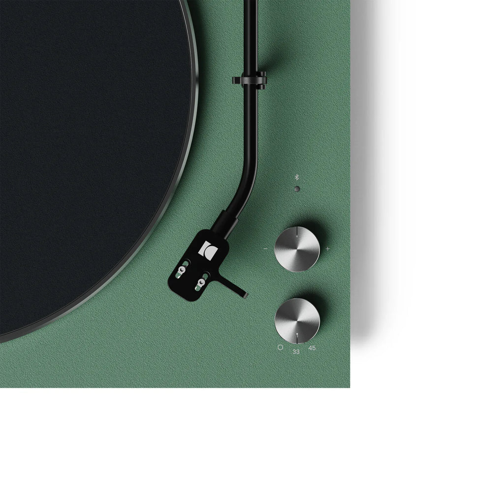 Close-up of the Kanto Audio OBI3 turntable's control knob, showcasing its sleek design and matte finish.