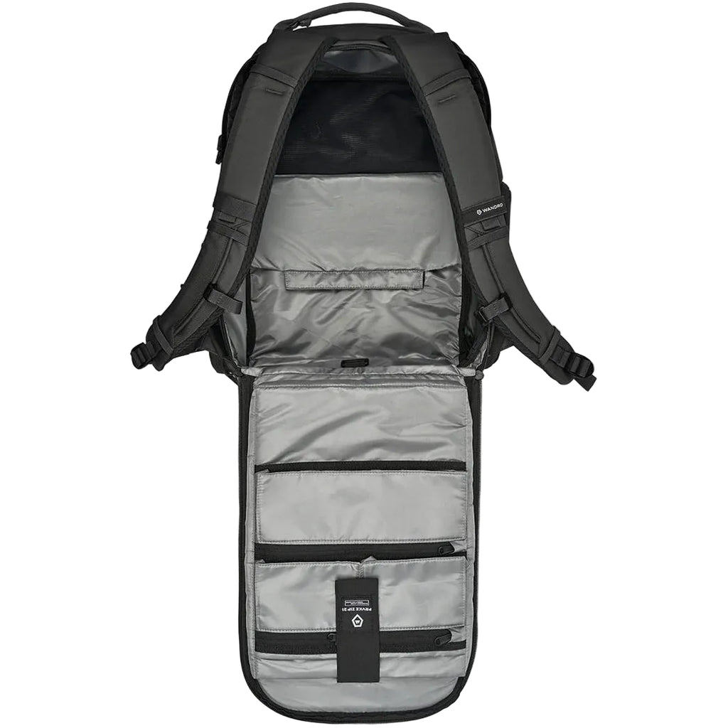 Interior view of the Wandrd Prvke Zip video equipment bag showing multiple compartments and padded padding for gear storage.