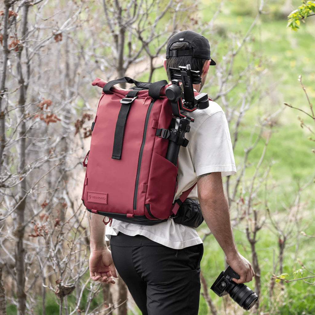 Wandrd PRVKE video equipment bag in Rhone Burgundy with multiple compartments and rugged design for camera gear storage.