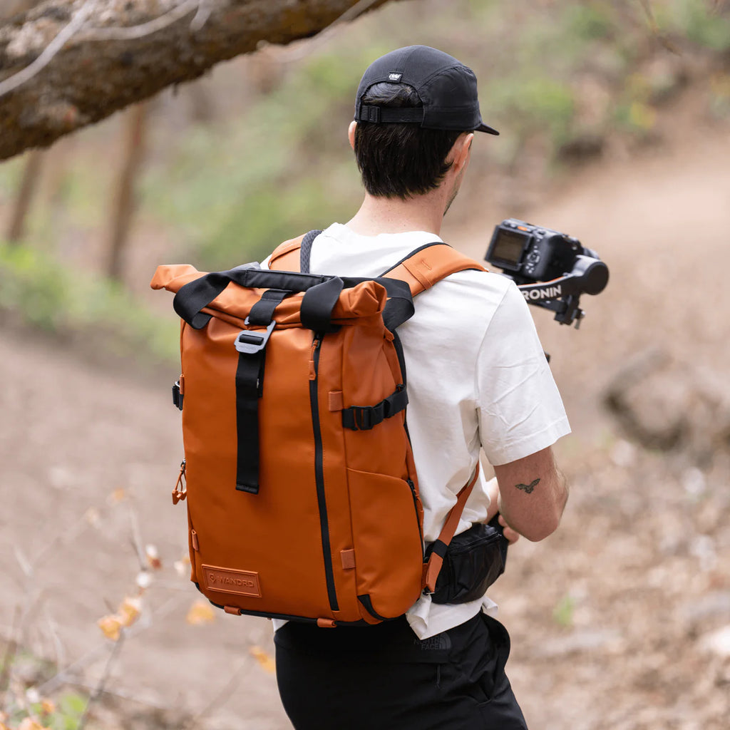 Wandrd Prvke bag in Sedona Orange, a versatile video equipment bag with multiple compartments and durable design.