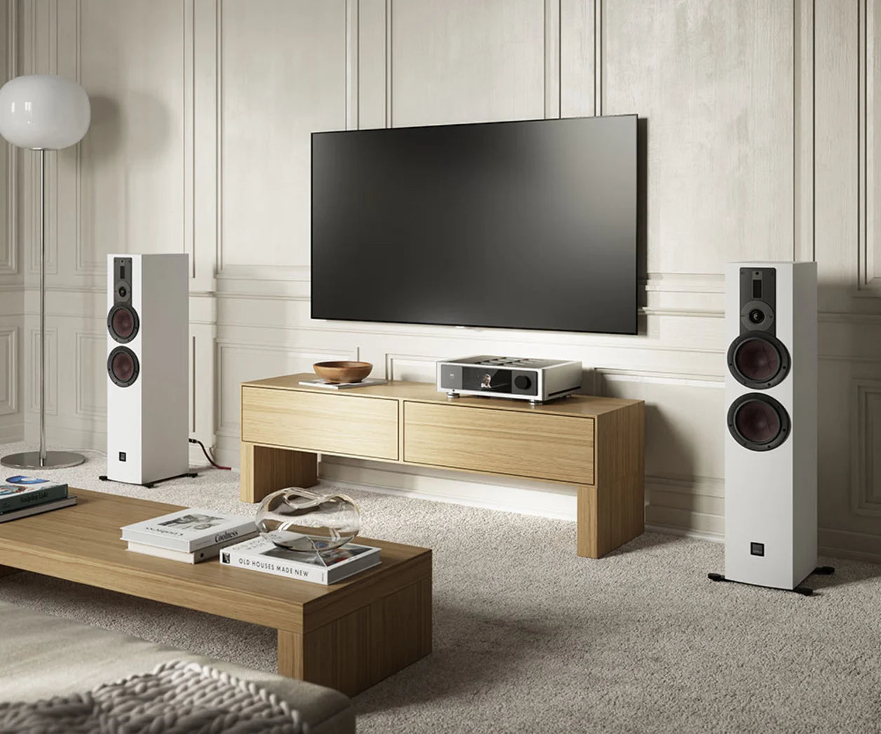 DALI Rubikore 6 passive floorstanding speakers in a living room setup, showcasing black cabinets and sleek design.