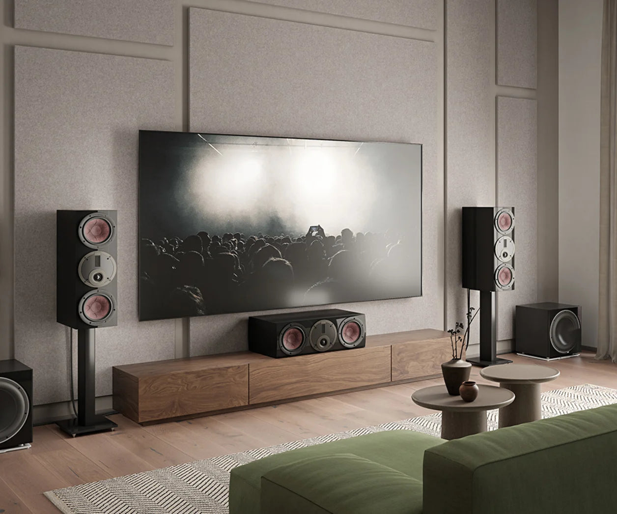 DALI Rubikore Cinema center speaker placed in a modern living room setting, showcasing sleek design and compact size.