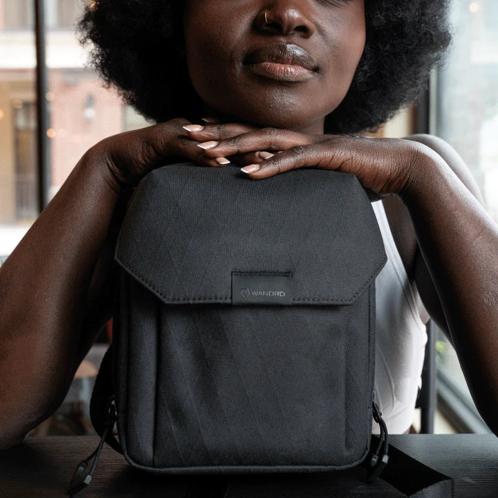 Wandrd X1 Cross Body video equipment bag with adjustable strap and padded compartments for cameras and accessories.