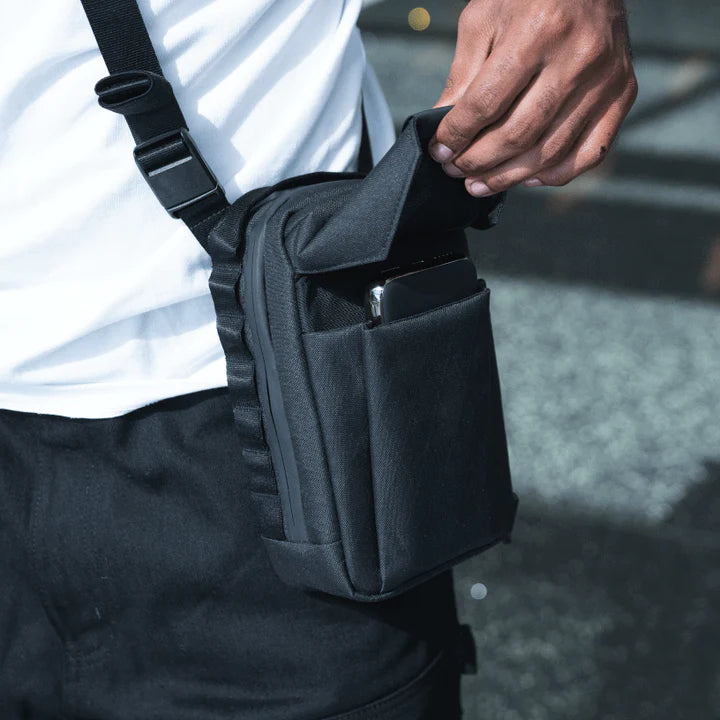 Wandrd X1 Cross Body video equipment bag with adjustable strap and padded compartments for camera gear and accessories.