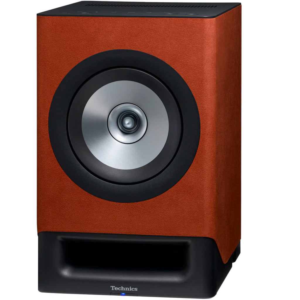 Technics SC-CX700 active bookshelf speakers with terracotta front, angled design, and sleek modern appearance.