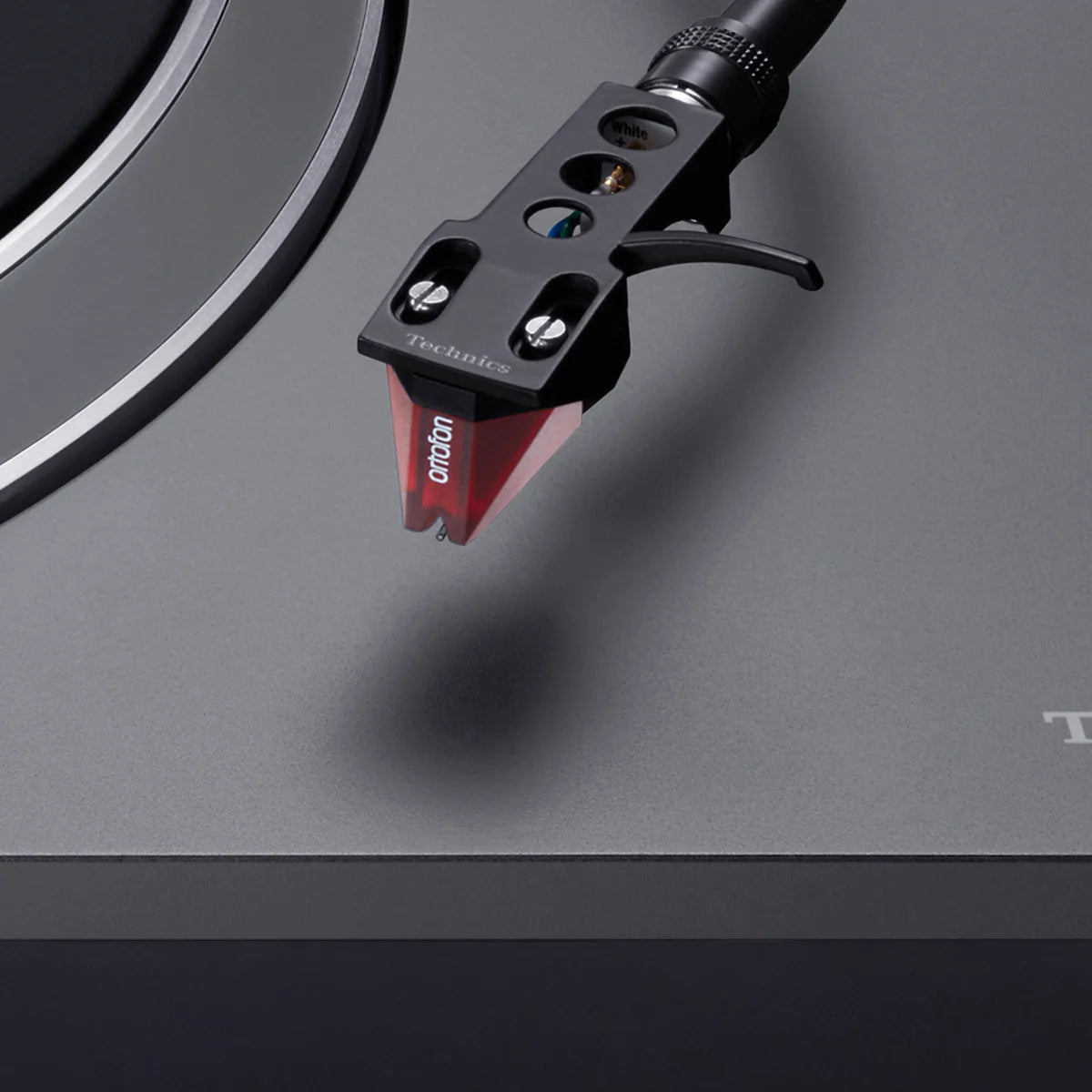 Technics SL-1500CS turntable with a close-up of the tonearm and cartridge, showcasing its sleek design and build quality.
