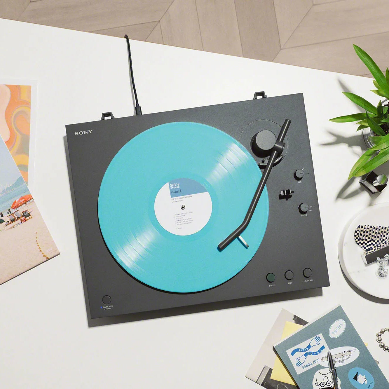 Sony PS-LX3BT turntable with a sleek black design, featuring tonearm and control buttons, ideal for vinyl record playback.