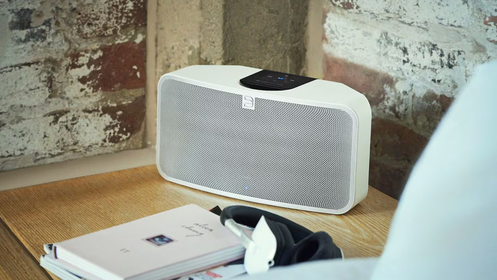Bluesound Pulse 2i wireless speaker with a sleek, compact design blending seamlessly into modern home decor.