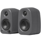 Kanto Audio UKI desktop speakers with sleek black finish and front speaker grille, designed for high-quality audio on a desk.