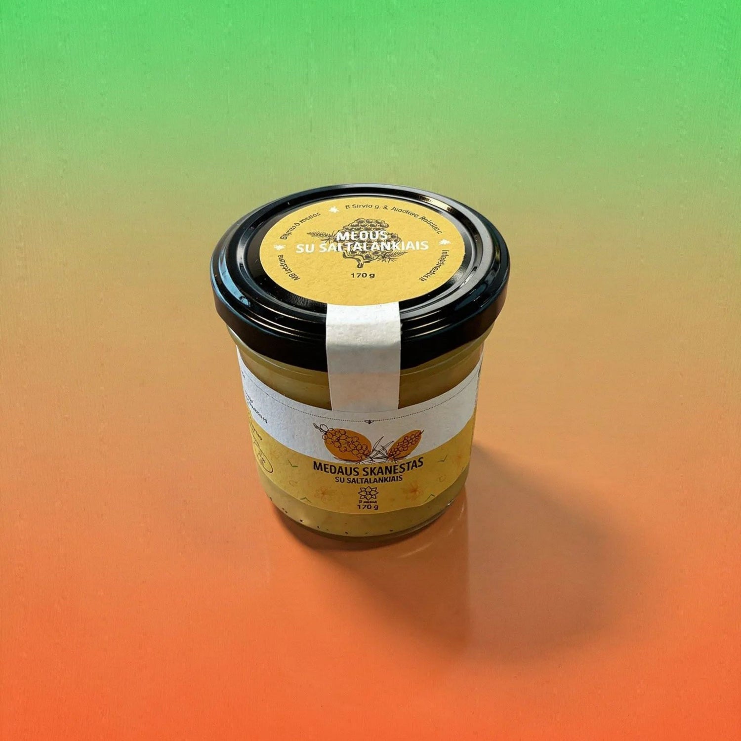 Jar of Medaus Skanestas honey on a gradient background