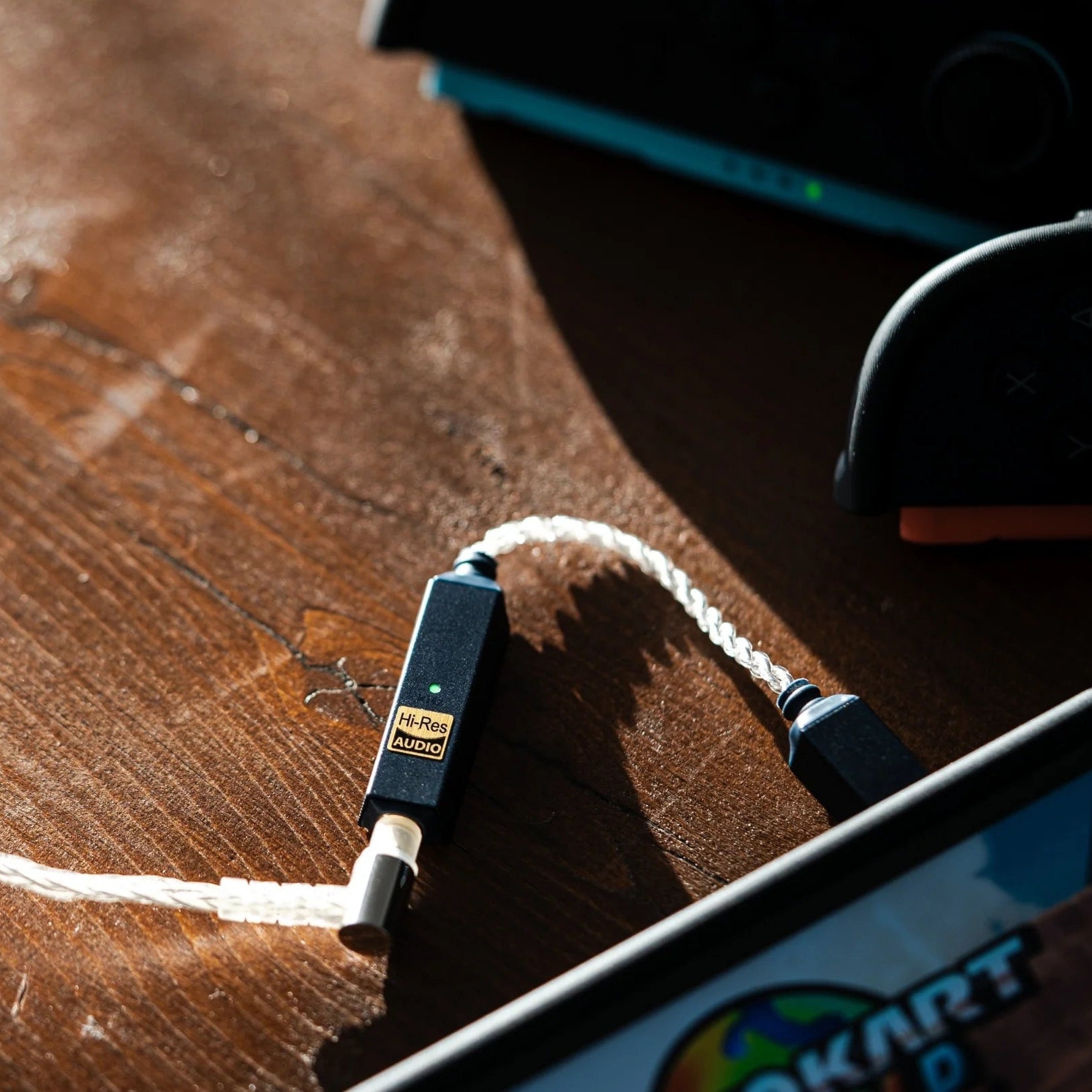 iFi Audio GO Link 2 headphone amplifier and DAC showing sleek black design with ports on the front and back for high-quality audio.