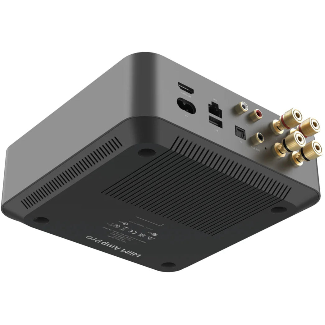 WiiM AMP Pro music streamer showing front display and control buttons, designed for high-quality wireless audio streaming.