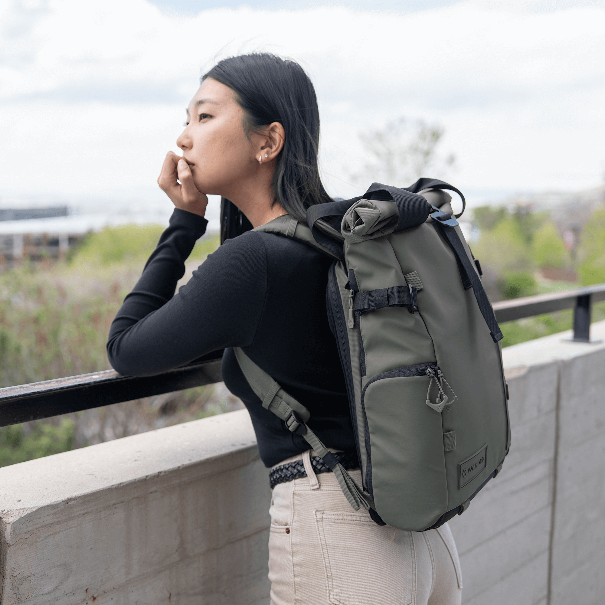 Wandrd Prvke 15L photo bundle in Wasatch Green with lifestyle scene, showing versatile video equipment bag with compartments.