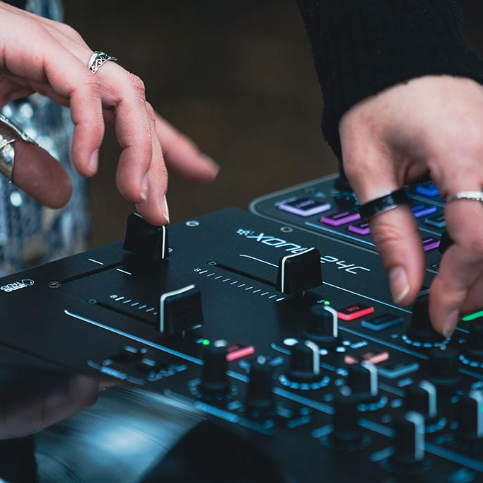 Allen & Heath Xone:24C DJ mixer with multiple channels, EQ controls, and professional audio interface in a sleek black design.
