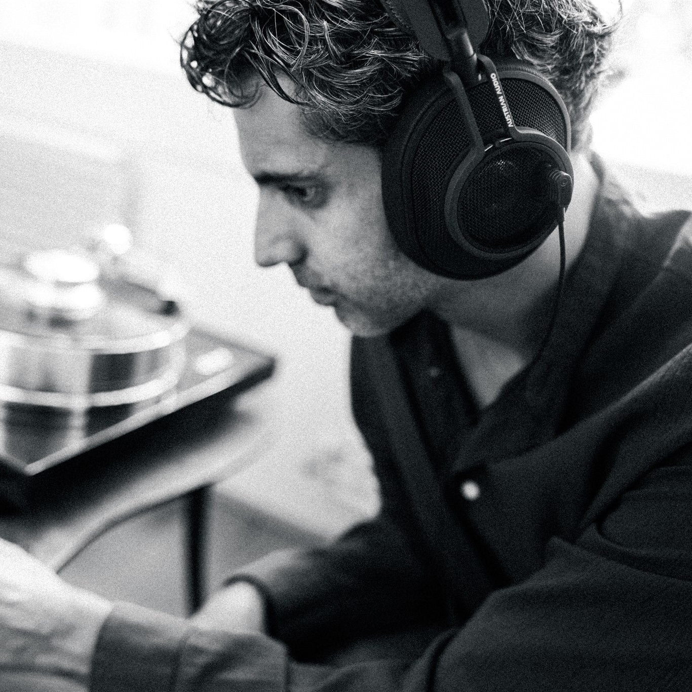 Austrian Audio The Composer wired headphones in black, featuring over-ear design and plush ear cushions for professional audio listening.
