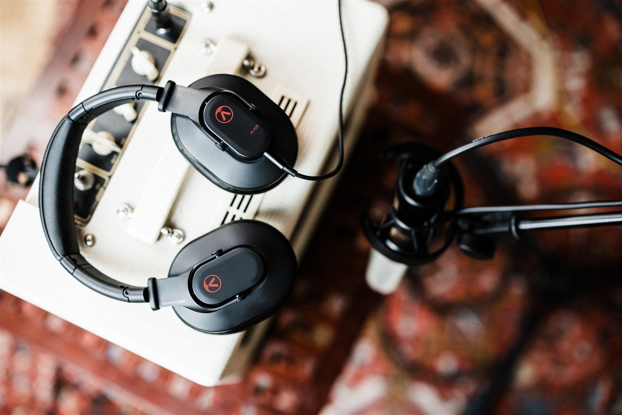 Austrian Audio Hi-X20 studio headphones with black and silver design, featuring over-ear cushioned ear cups and adjustable headband.