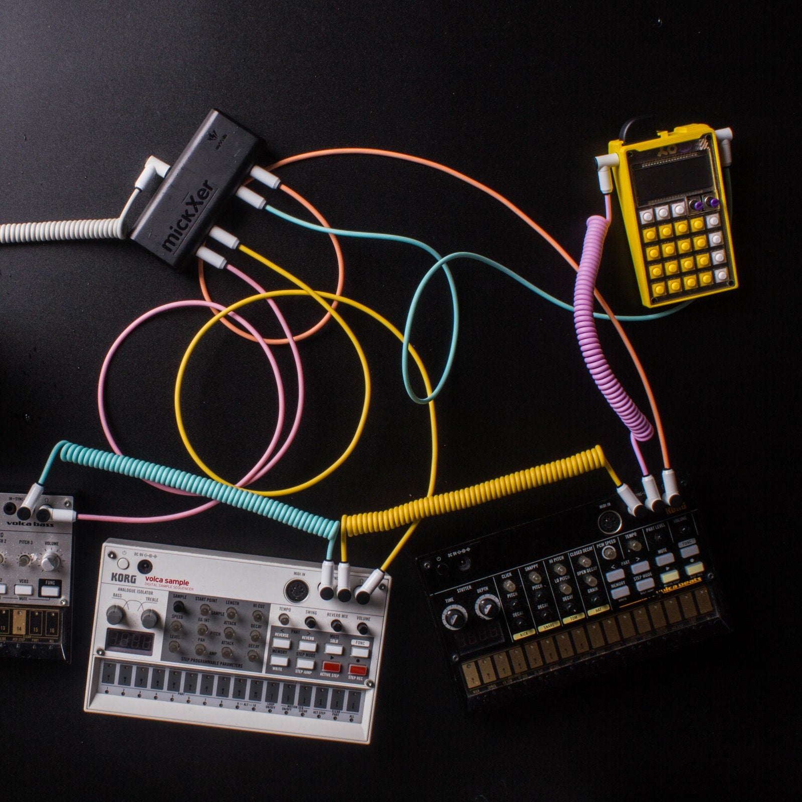 myVolts MickXer noise filter and conditioner in action, showing its sleek design and ports for audio equipment connection.