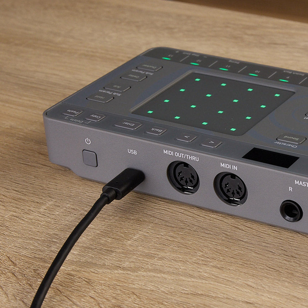 AlphaTheta ChordCat DJ pad controller, USB cable connected to rear ports.