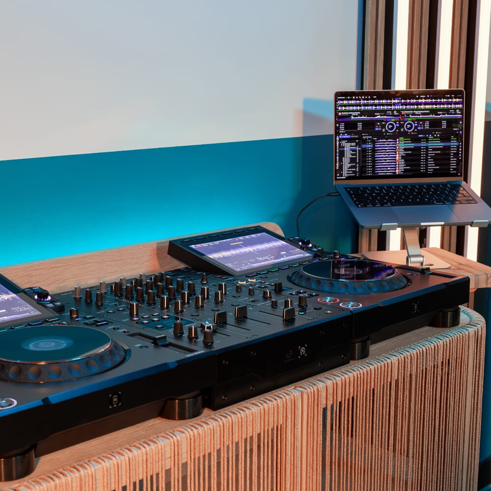 AlphaTheta DJM-V5 DJ mixer with multiple controls, knobs, and inputs on top view for professional audio mixing.