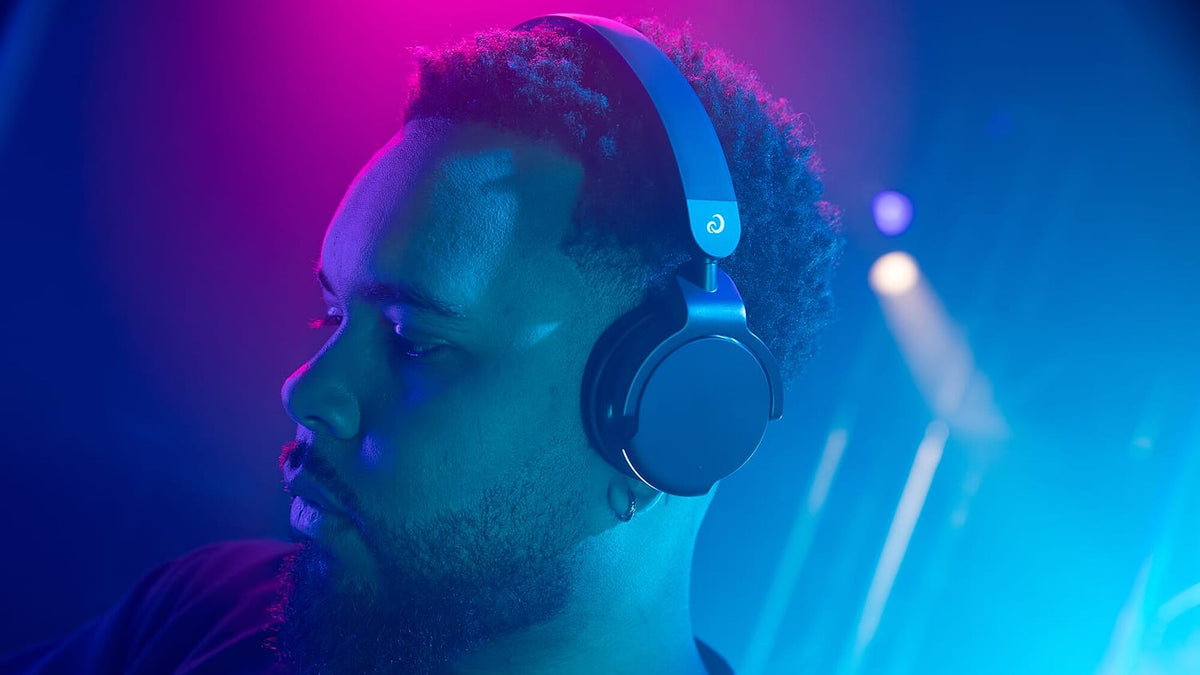 AlphaTheta HDJ-F9 DJ headphones worn in a club